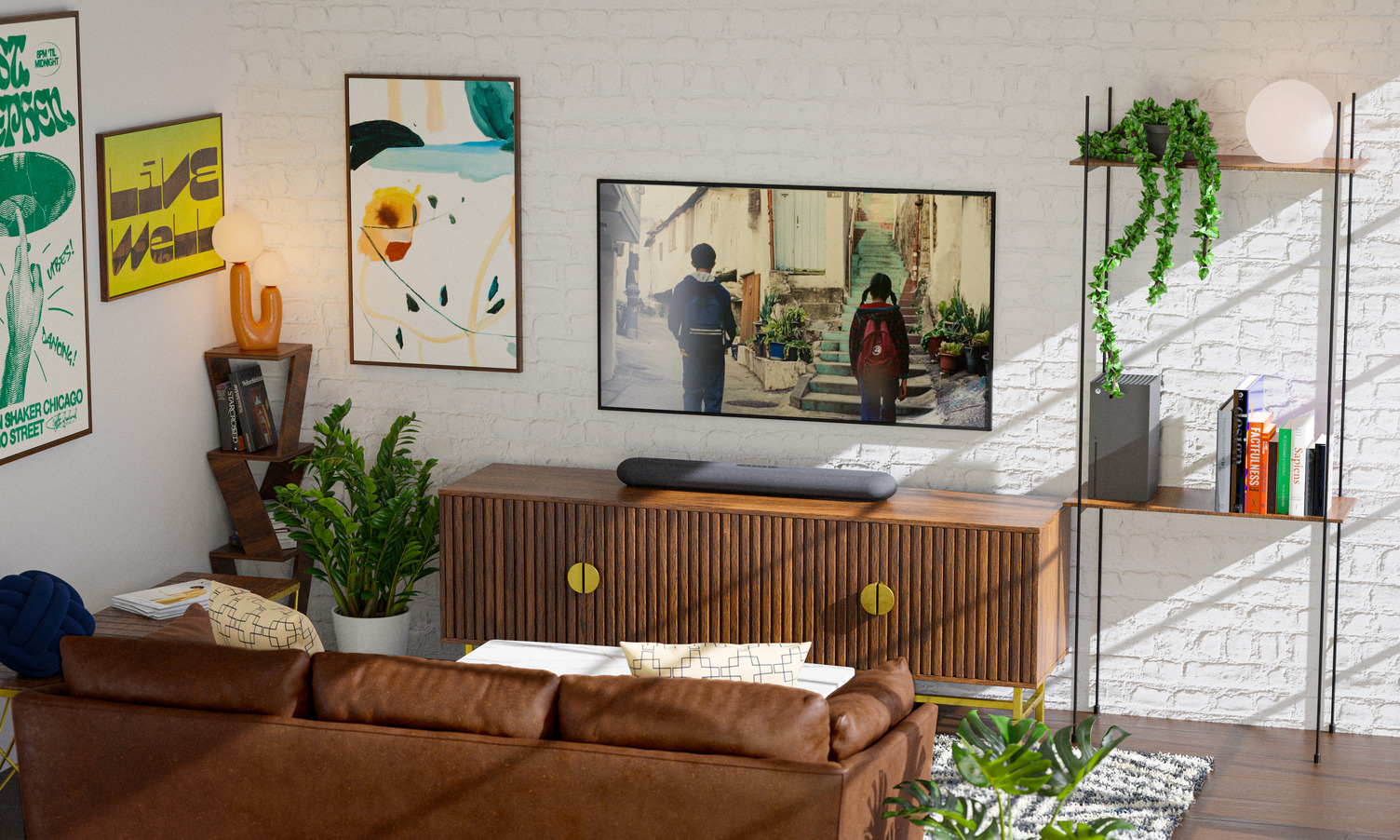 Lifestyle shot of the Bluesound Pulse Cinema Mini soundbar sat on a wooden sideboard-style unit in a white-walled room with lots of pot plants dotted around