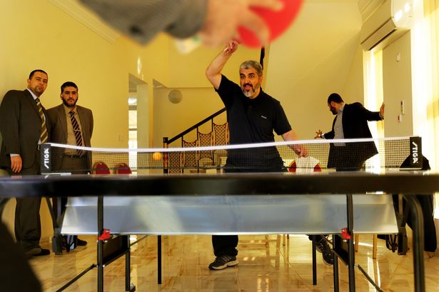 Khaled Mashal, head of Hamas abroad, is seen playing table tennis