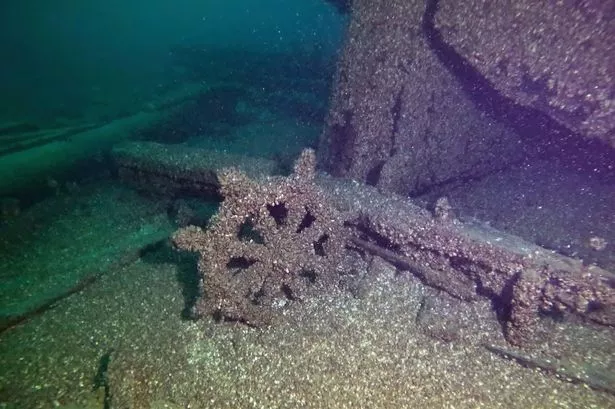 The wheel of the F.J. King shipwreck is seen in Lake Michigan
