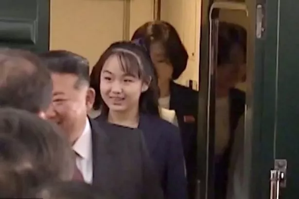 Kim Ju Ae getting off a train