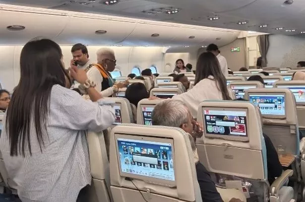 Passengers seen fleeing the Emirates flight