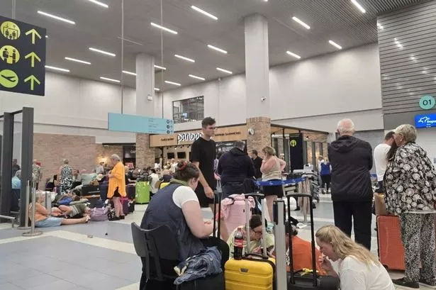The airport is packed with passengers facing delays