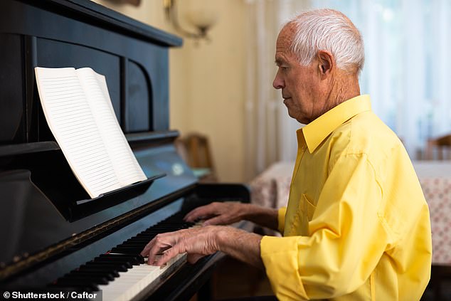 Older adults who practiced music 12 hours a week showed similar brain activity to younger adults in their 20s (Stock Image)
