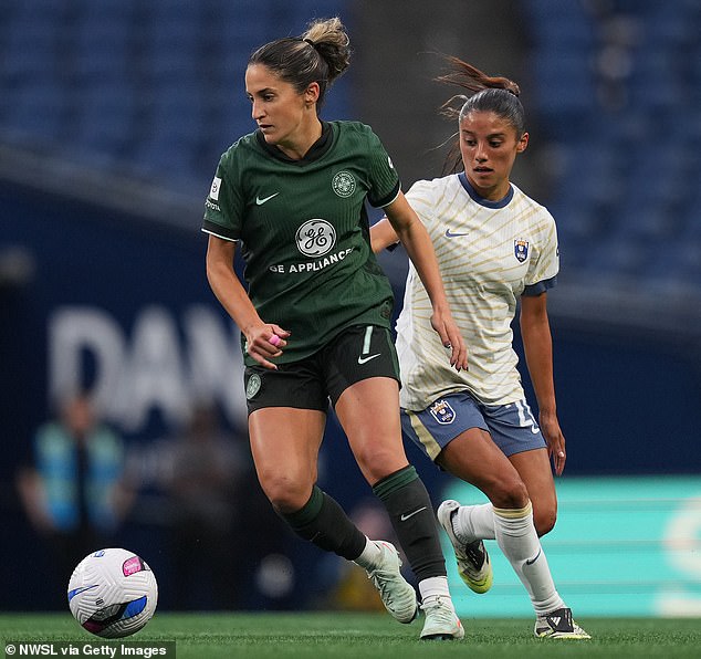 A game between Racing Louisville and Seattle Reign was abandoned after Louisville midfielder Savannah DeMelo (green kit) collapsed on the pitch just before halftime