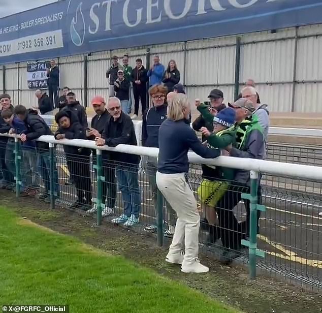 Robbie Savage gave Forest Green Rovers fans a glimpse of his softer side as he carried a young supporter onto the pitch