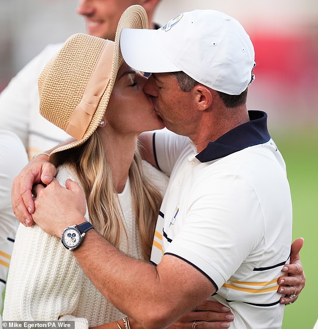 At the end of an emotional week, Rory McIlroy kisses his wife Erica at the Ryder Cup