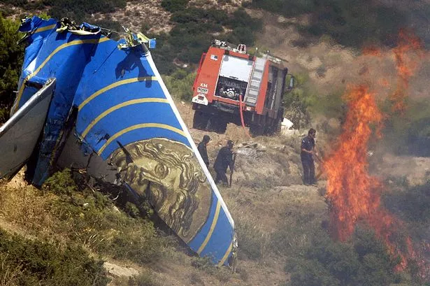 The tail fin of the Cypriot passenger plane, Helios airways carrying 115 passengers and 6 crew which crashed into the mountains near Athens