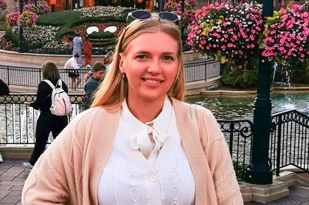 Anastasiia Chikina poses for a photo smiling in an outdoor area