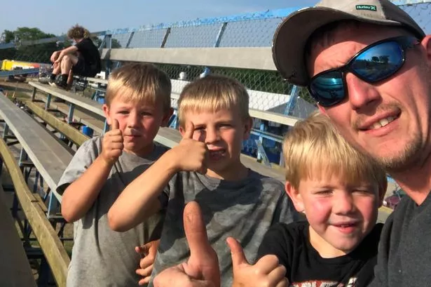 Chad Doerman with his three sons