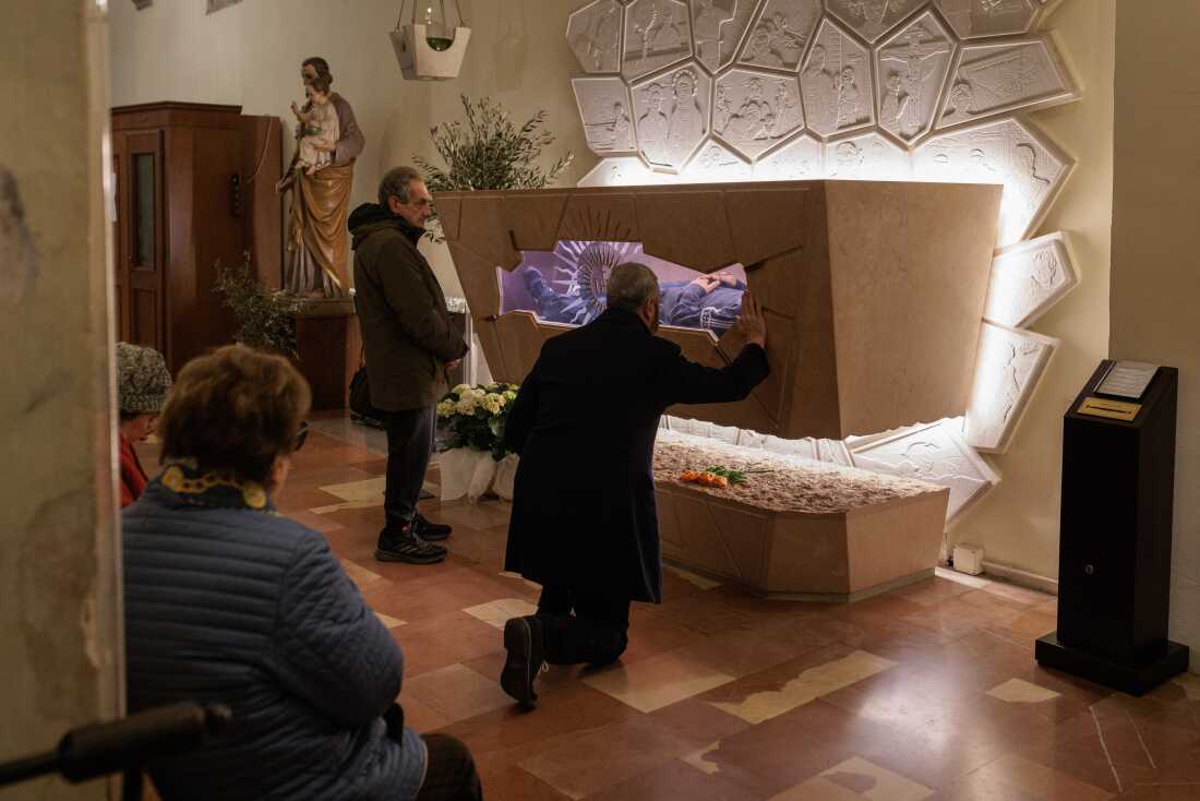 The remains of Carlo Acutis have rested since April 6, 2019, in the Sanctuary of the Spoliation in St. Mary Major Church in Assisi, inside a sepulchral monument in the right nave. The body, after being transferred from its previous burial in a cemetery, was prepared through preservation techniques to be displayed to the faithful, who come to venerate him in this important place of worship.