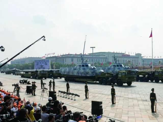 members of the people s liberation army stand as unmanned maritime drones are displayed during a military parade to mark the 80th anniversary of the end of world war two in beijing china photo reuters