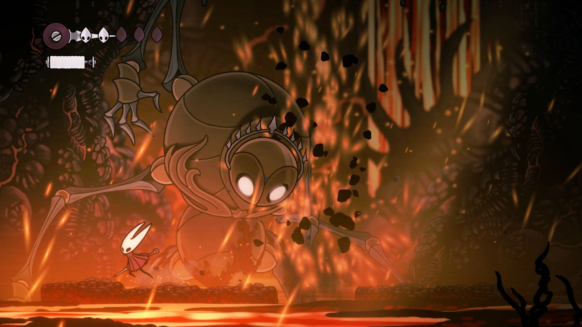 Hornet faces a boss enemy against a fiery level backdrop