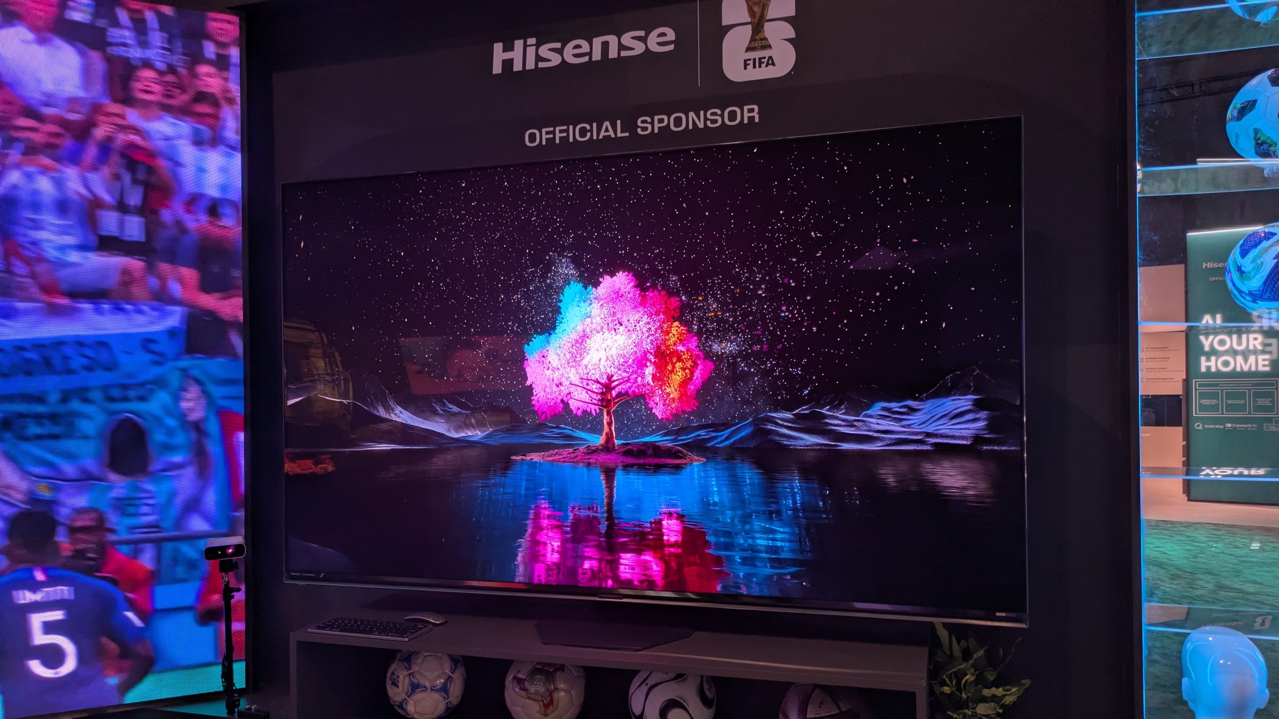Hisense 85-inch RGB mini-LED with pink tree against night sky on screen