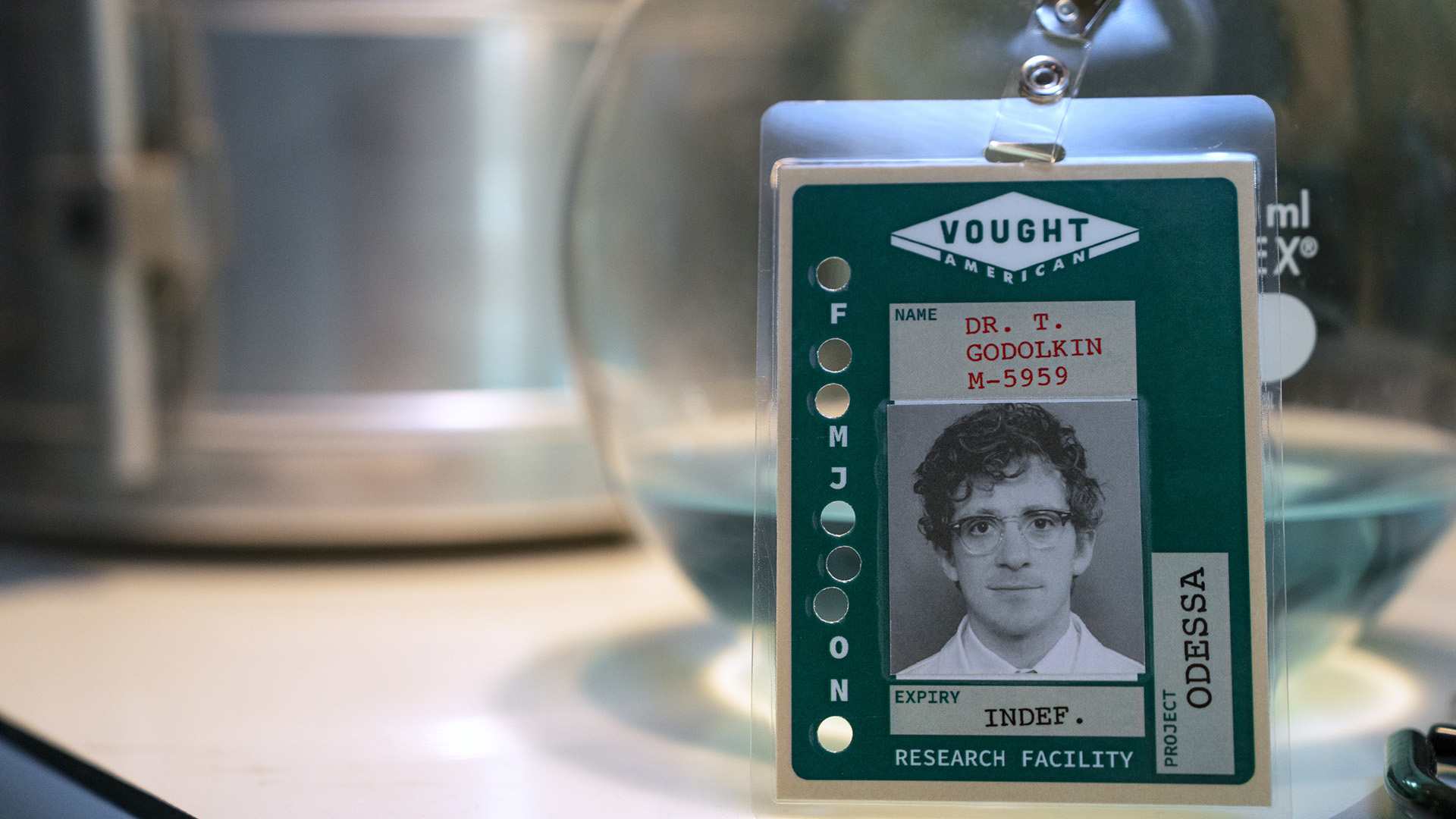 A screenshot of Doctor Thomas Godolkin's nametag badge propped up on a table in Gen V season 2