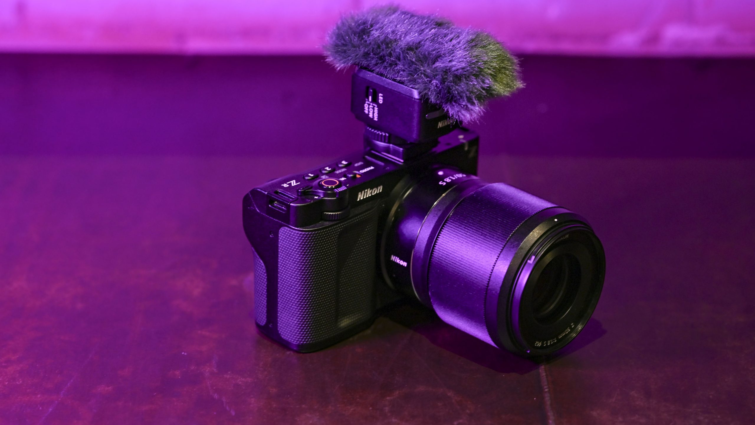 Nikon ZR camera with mic attached under low key magenta lighting