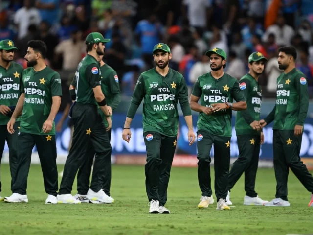 salman ali agha walks off with his teammates after pakistan s defeat against india in the asia cup photo afp