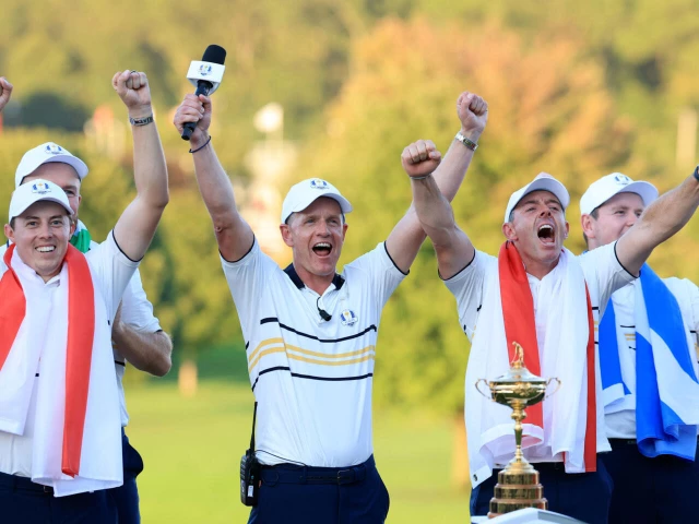 europe captain luke donald center celebrates winning the ryder cup with europe players matt fitzpatrick left and rory mcilroy right photo afp