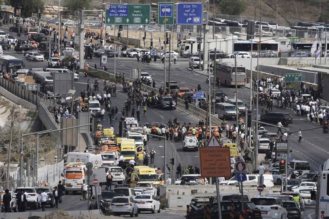 Israeli police and rescue teams respond at the scene of a shooting attack where several people killed and injured in Jerusalem, Monday, Sept. 8, 2025.