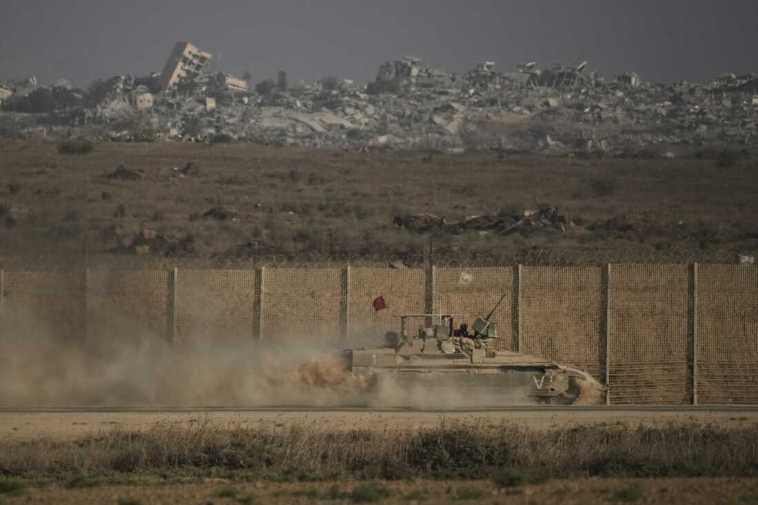 An Israeli armored vehicle moves along the Israeli-Gaza border as seen from southern Israel, Tuesday, Sept. 16, 2025.
