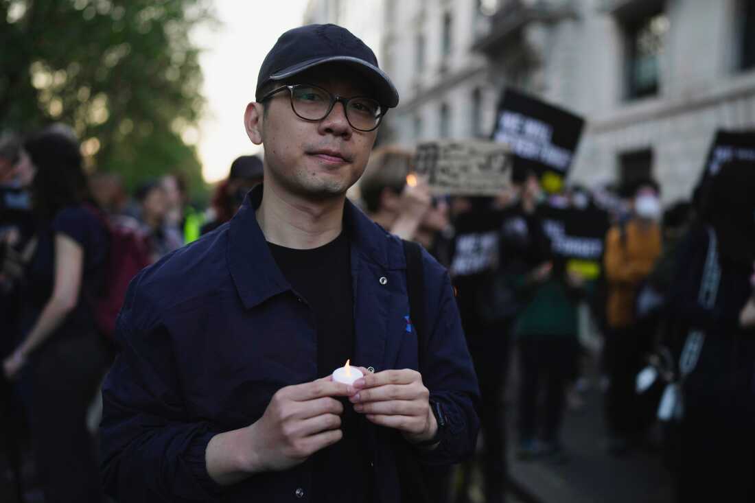 FILE - Hong Kong activist Nathan Law attends a candlelight vigil outside the Chinese Embassy in London on June 4, 2023, to mark the anniversary of China