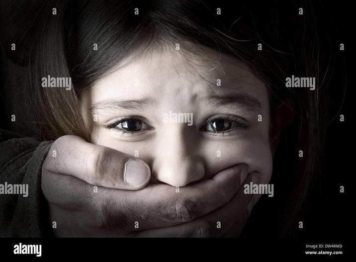 A stock image titled "Scared young girl with an adult man