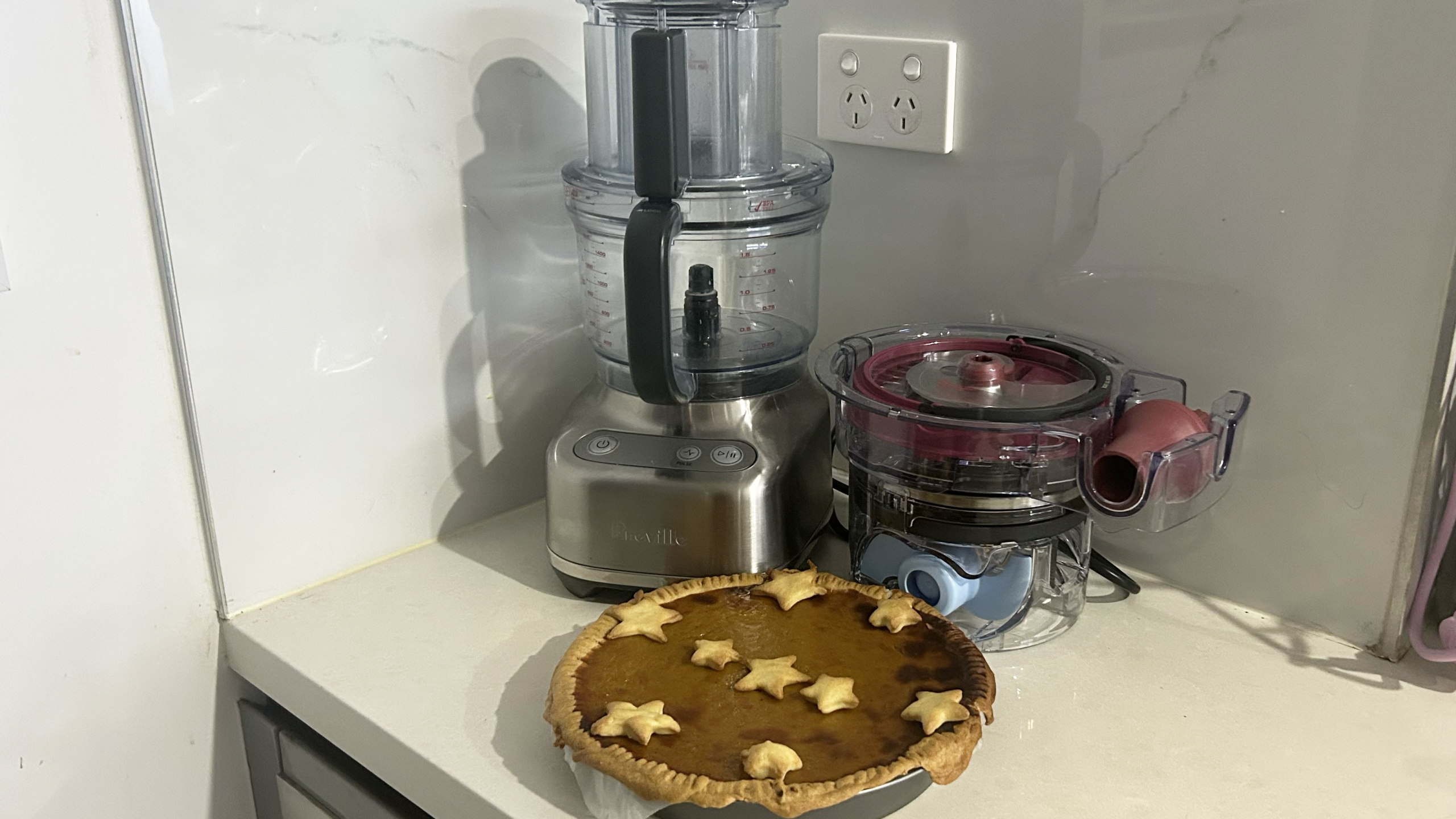 Breville Paradice 9 on white kitchen bench with pumpkin pie