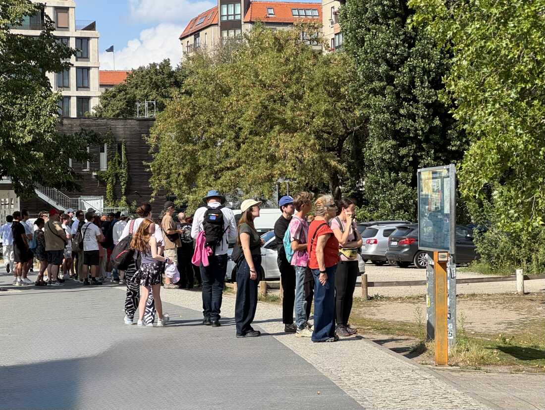 Tourists gather at a parking lot in the center of Berlin, Germany.