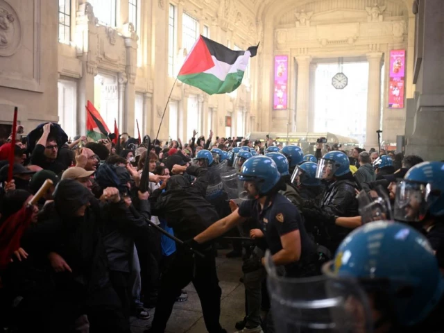 protesters clash with anti riot police near milano centrale train station on the sidelines of a nationwide strike organized by the unione sindacale di base usb union in milan northwestern italy on september 22 2025 photo afp