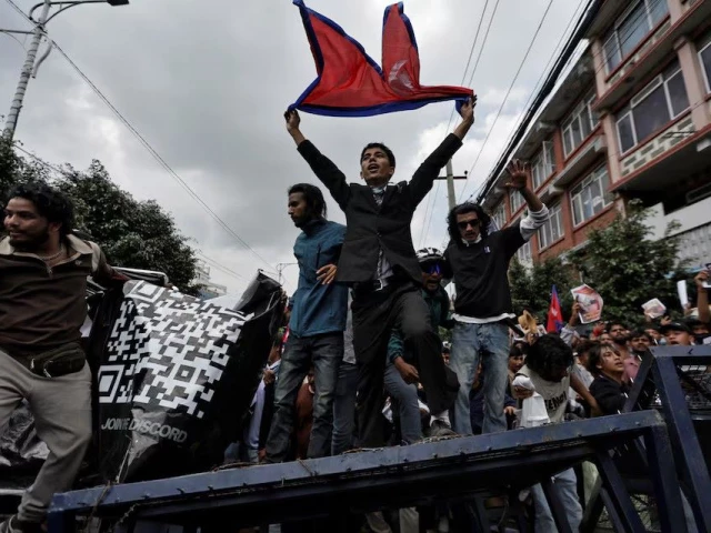 demonstrators shout slogans as they stand on a barricade during a protest against corruption and the government s decision to block several social media platforms in kathmandu nepal september 8 photo reuters
