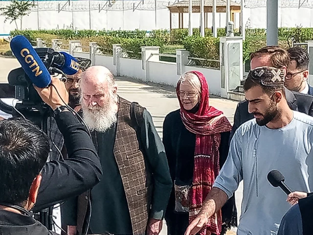 british nationals peter reynolds centre l and his wife barbara centre r speak with journalists upon their release from taliban custody at kabul airport on september 19 2025 an elderly british couple detained in afghanistan for almost eight months were released on september 19 the taliban authorities said after pressure built to free the pair due to fears over their health photo afp