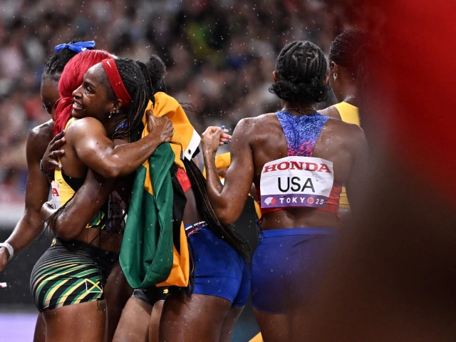 us twanisha terry hugs jamaica s athlete shelly ann fraser pryce l after the women s 4x100m relay final during the world athletics championships in tokyo photo afp