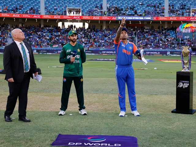 indian captain suryakumar yadav tosses the coin as pakistan skipper agha salman looks on ahead of the highly anticipated asia cup 2025 clash between india and pakistan at the dubai international stadium photo x