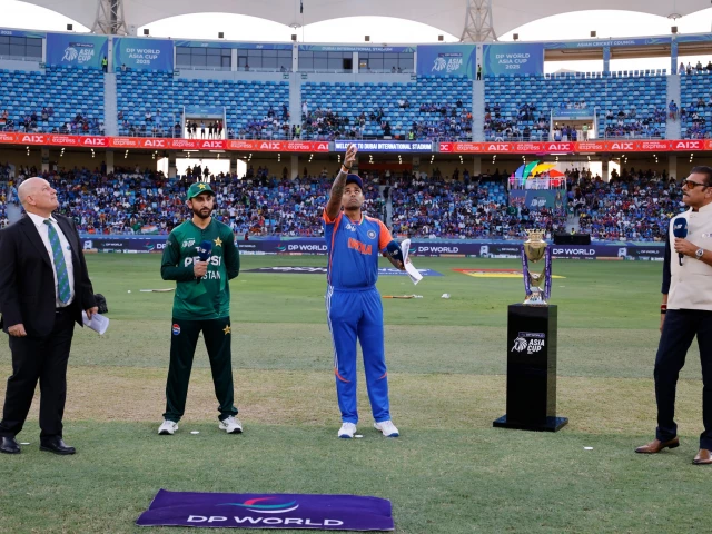 indian captain suryakumar yadav tosses the coin as pakistan skipper agha salman looks on ahead of the highly anticipated asia cup 2025 clash between india and pakistan at the dubai international stadium photo pcb