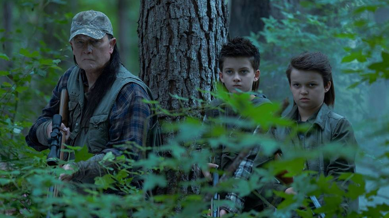 Auggie, Keith, and Chris on a hunting trip in a forest in Peacemaker season 2 episode 4