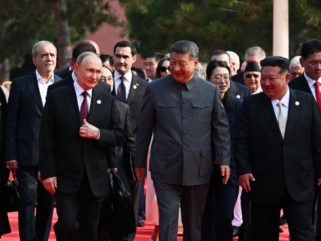 in this pool photograph distributed by the russian state agency sputnik l r russia s president vladimir putin walks with china s president xi jinping and north korea s leader kim jong un before a military parade marking the 80th anniversary of victory over japan and the end of world war ii in beijing s tiananmen square on september 3 2025 photo afp