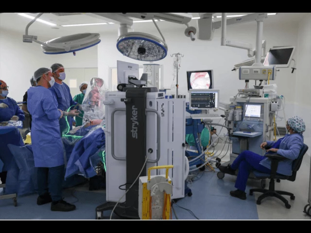 ricardo funke chief of surgery at clinica las condes uses an autonomous artificial intelligence guided camera and mars magnetic assisted robotic surgery robots while performing a gallbladder removal alone in santiago chile september 8 2025 photo reuters