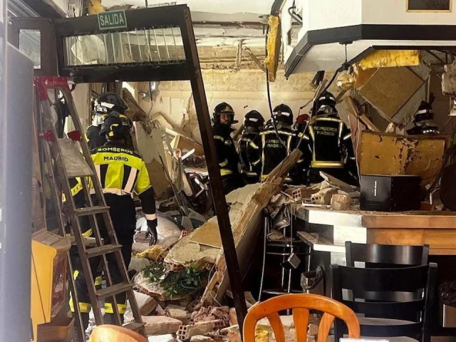firefighters work at the site after an explosion in a cafe injured at least 21 people three of them seriously according to emergency services in madrid spain september 13 2025 photo reuters
