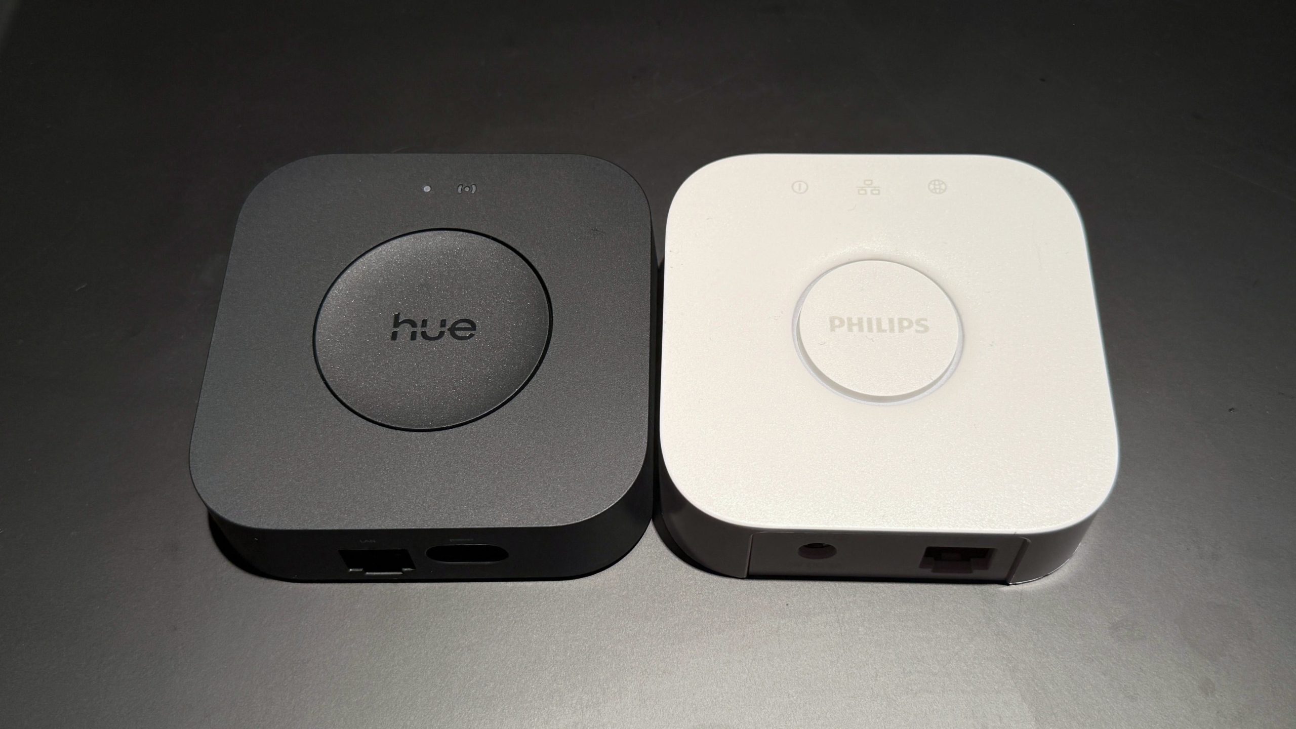 Philips Hue Bridge Pro beside Philips Hue Bridge V2