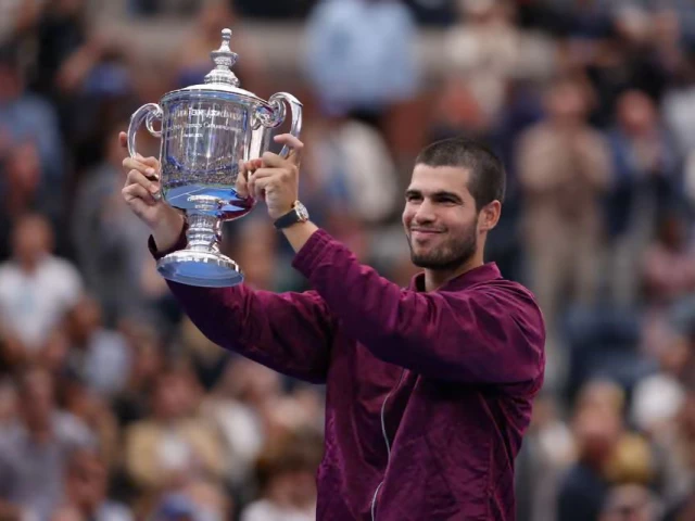 carlos alcaraz poses with the us open trophy after his victory photo reuters