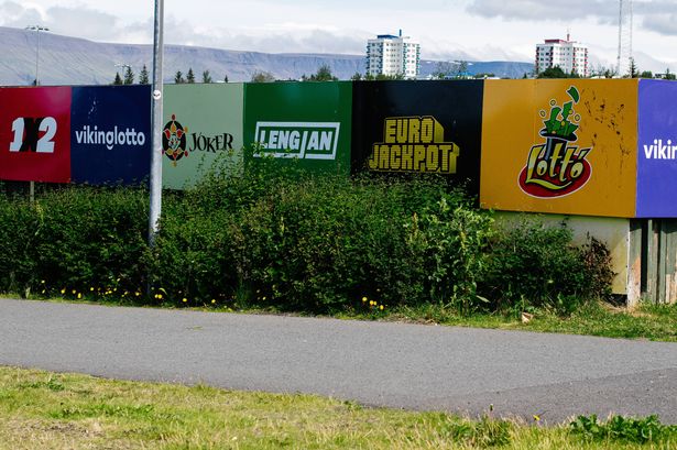 Reykjavik, Iceland - June 28, 2025: Bright lottery themed advertisements displayed on colorful boards in Reykjavik, Iceland.