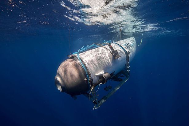This undated image courtesy of OceanGate Expeditions, shows their Titan submersible beginning a descent