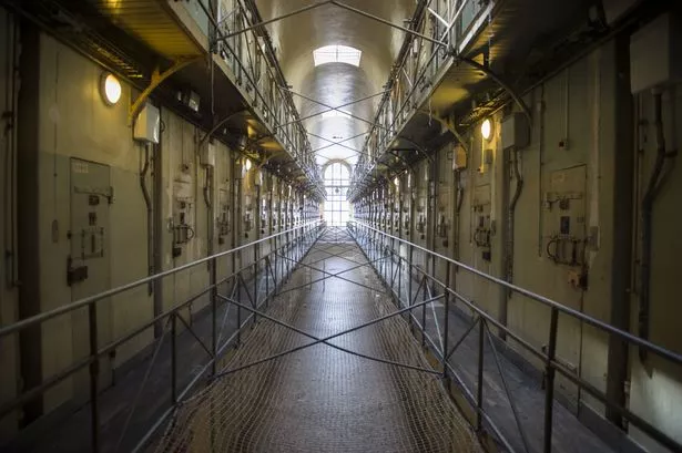 A picture shows a corridor of the Parisian prison of