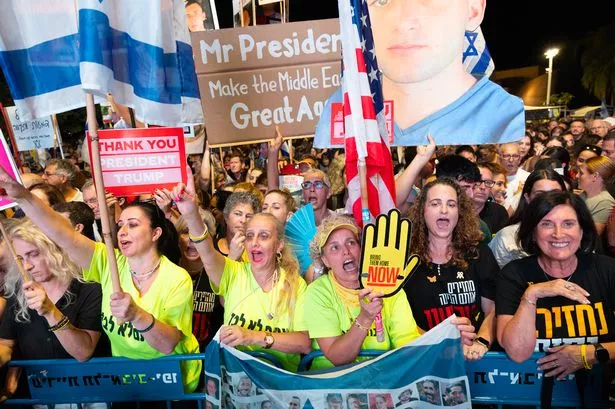 Relatives of hostages and other Israelis await news of their release at Hostage Square, Tel Aviv, on Saturday