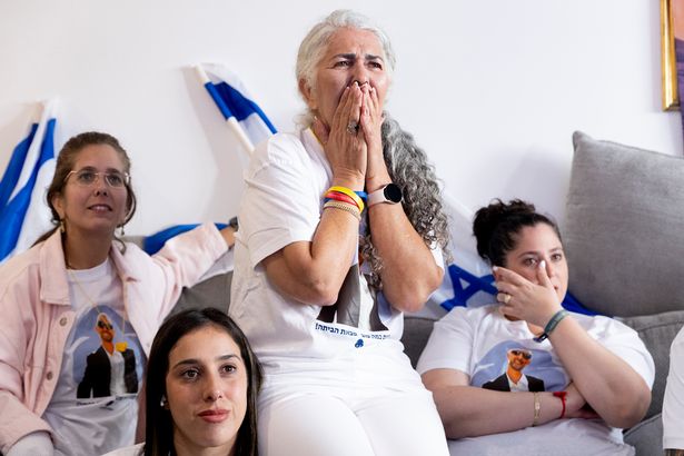 Relatives of hostage Elkana Bohbot gather to watch his release from Hamas captivity on October 13