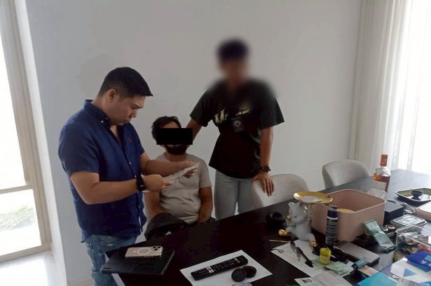 A man being arrested in Bangkok