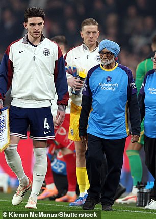 England and Wales players walked out with mascots with dementia ahead of their match at Wembley on Thursday
