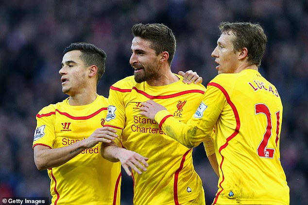 Fabio Borini (centre, in 2015) has signed a surprise deal to join Salford City over a decade after playing for Liverpool