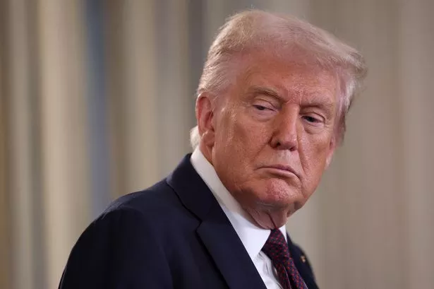 U.S. President Donald Trump looks on as Israeli Prime Minister Benjamin Netanyahu delivers remarks during a joint news conference in the State Dining Room at the White House on September 29, 2025 in Washington, DC.