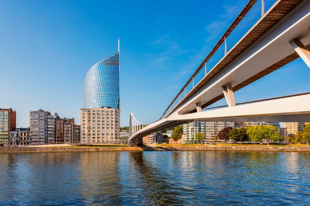 Modern foot and bicycle bridge crossing the Meuse River in Liège, Wallonia, Belgium.