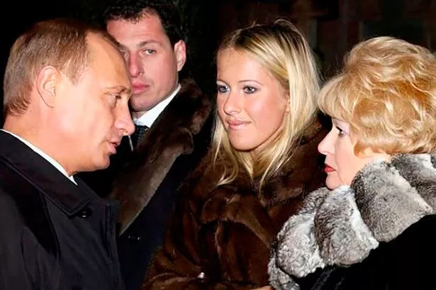 Ksenia Sobchak (c) pictured with Putin in St Petersburg in 2003
